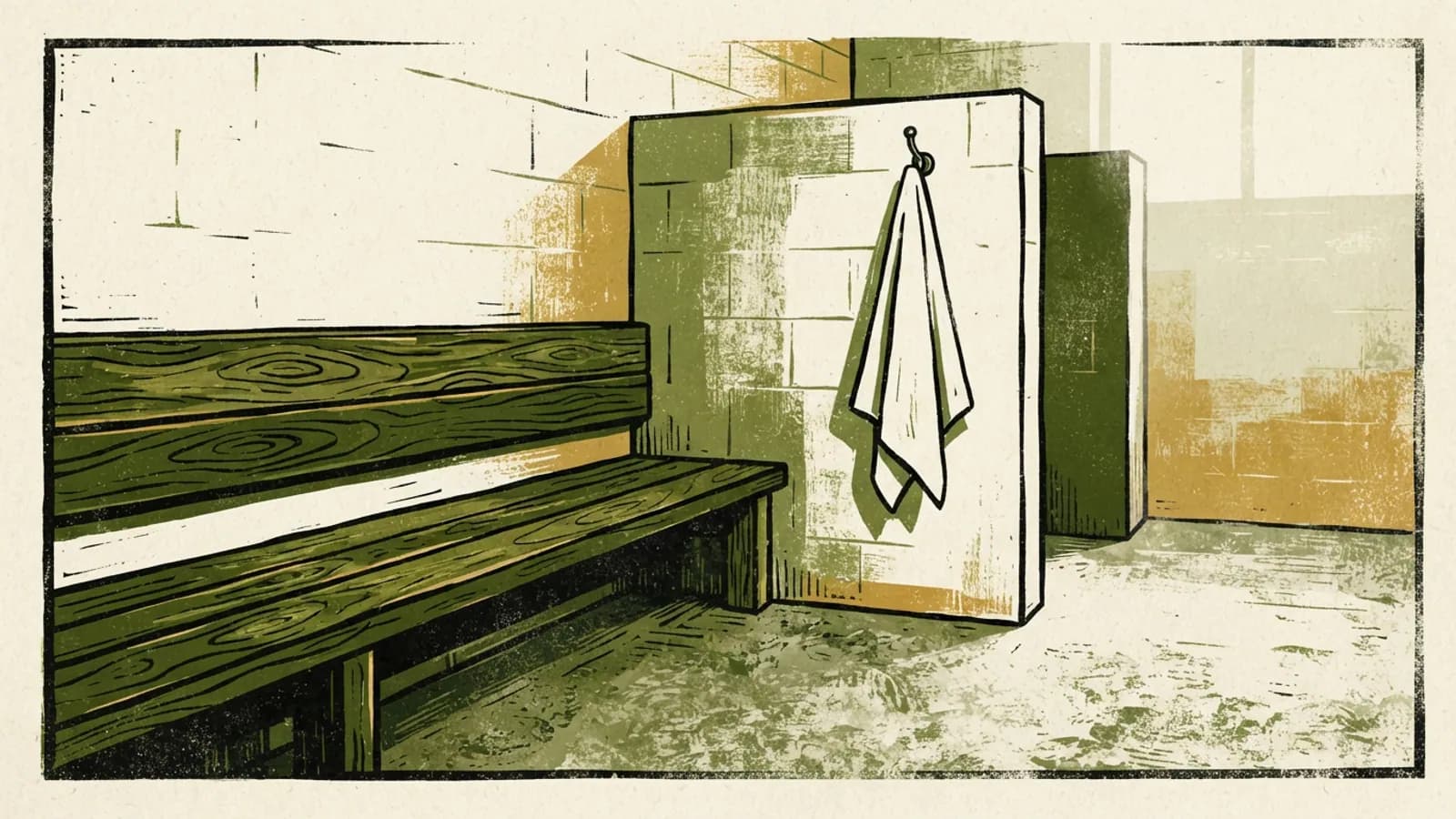 An empty indoor swimming pool changing cubicle with a bench and a towel.